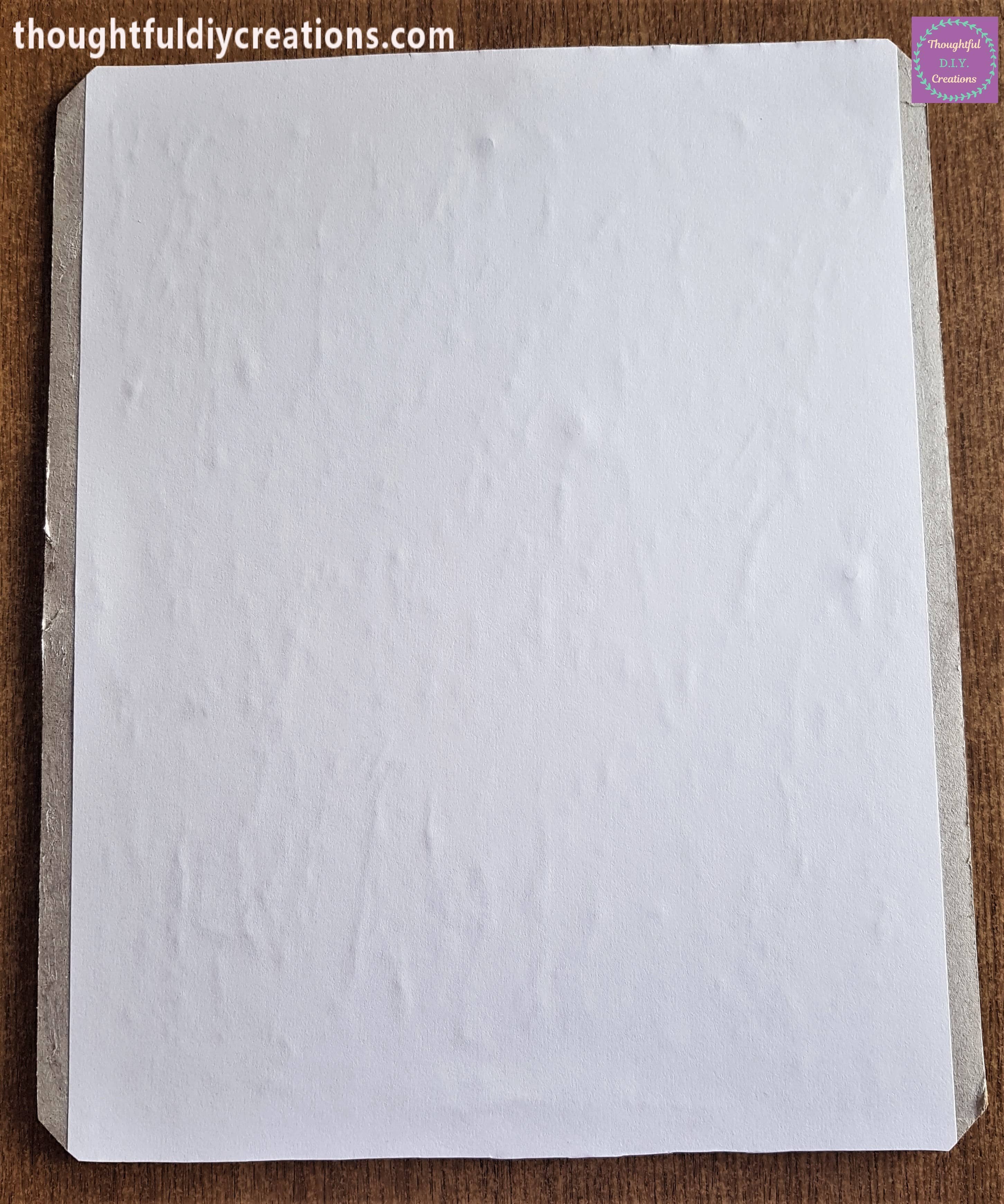 Excess paper cut off around the frame.