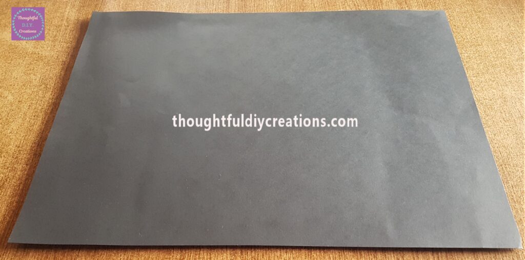 The Black Card turned sideways and pressed into the Backing Board.