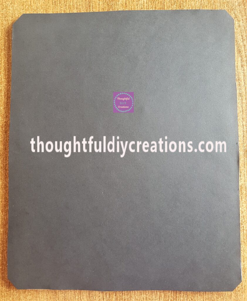 I Cut around the back of the frame to remove the excess black paper.