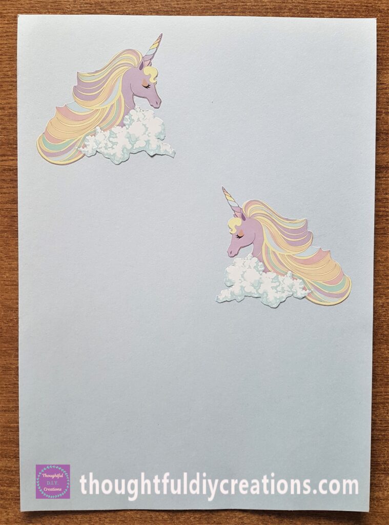 Pritt Stick on the back of the Unicorns and attached to a Light Bllue Card.