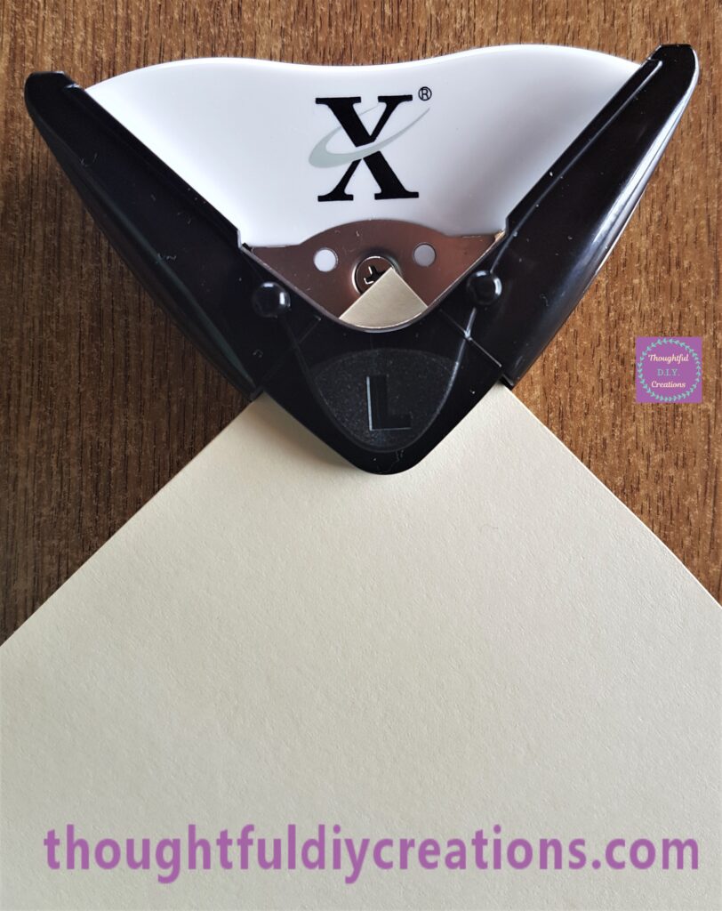 The corner of the Sheet put into the Black side of the Corner Punch and pressed down the black L section of the punch to remove the corner.