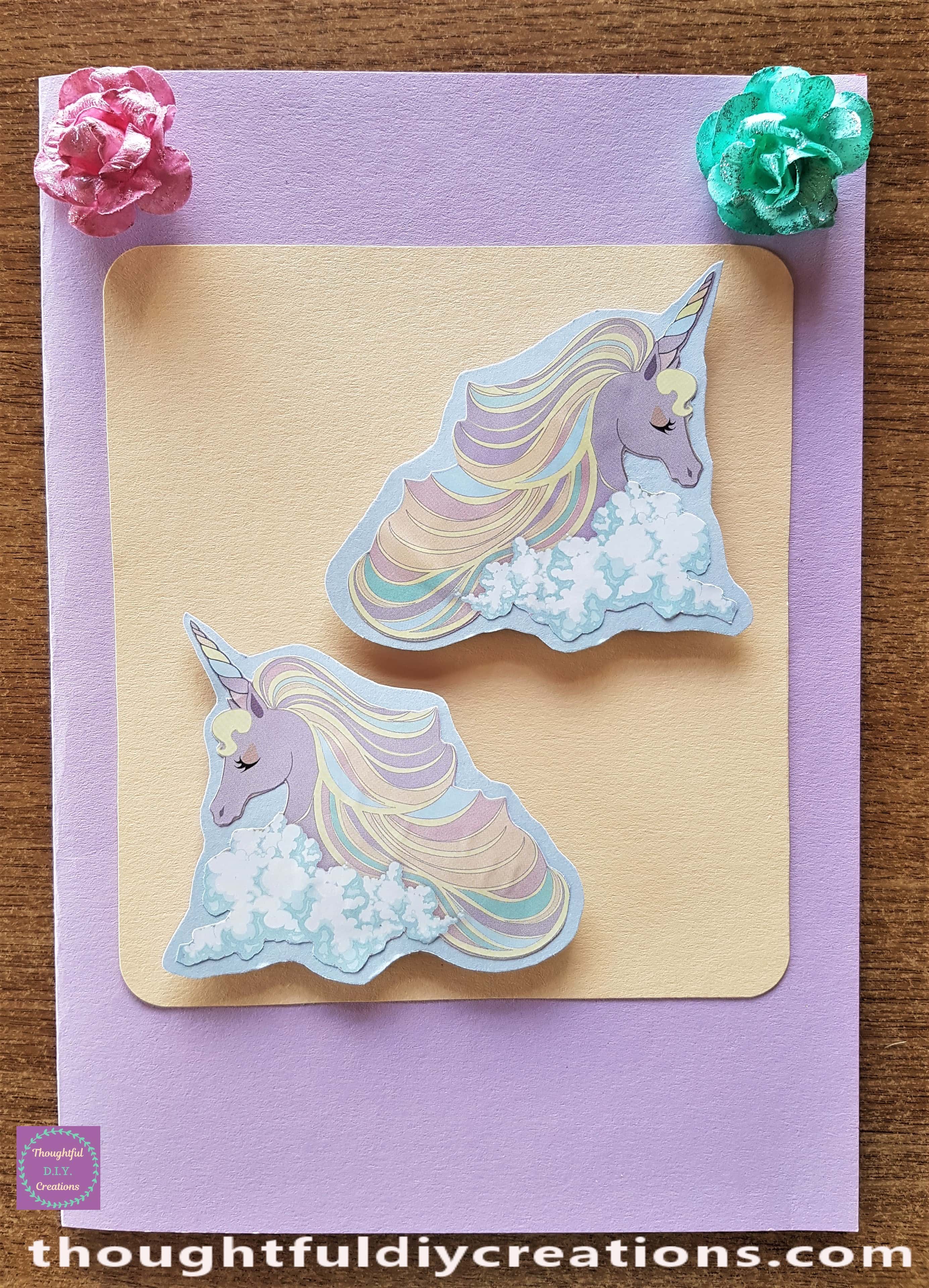 The Flowers attached to the top corners of the Card using my Hot Glue Gun.