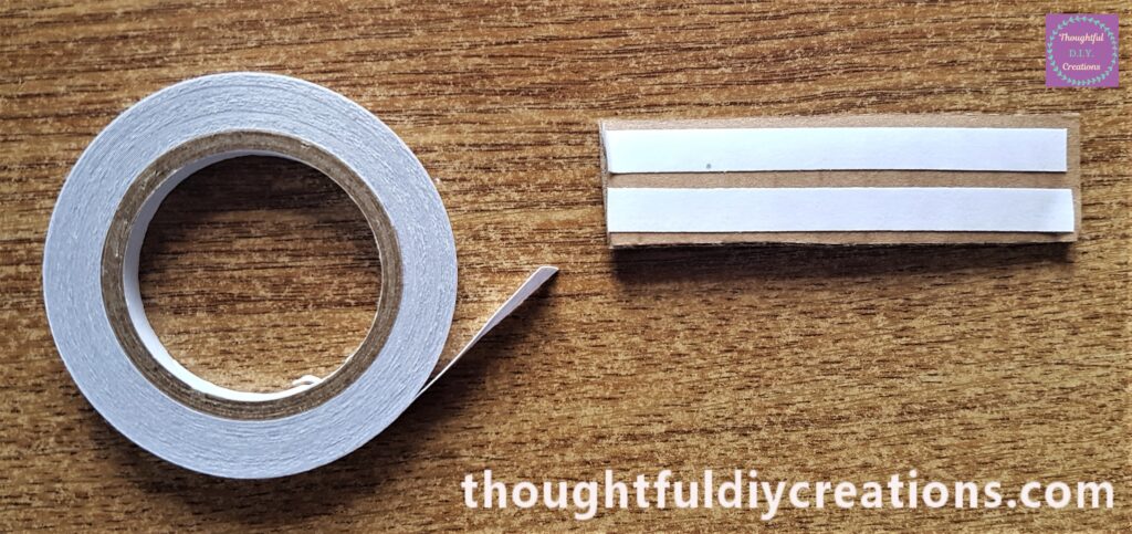 2 strips of Double-Sided Tape on the Cardboard.