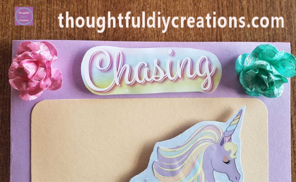 Hot Glue on the back of the Cardboard and attached the word 'Chasing' to the Card.
