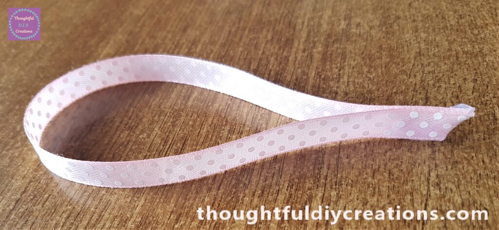 Cut a section of the ribbon and hot glued the ends together.