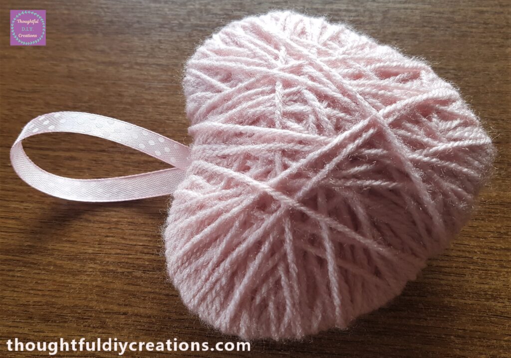 Side angle of the Ribbon attached to the heart.