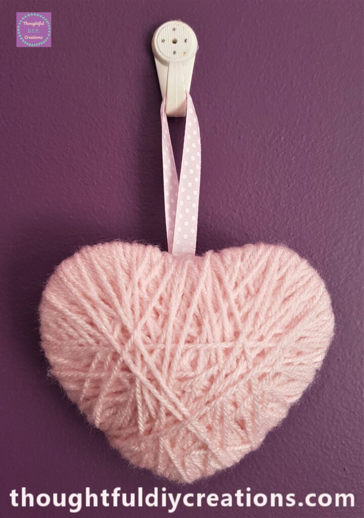 Pink Wool Heart hung up.