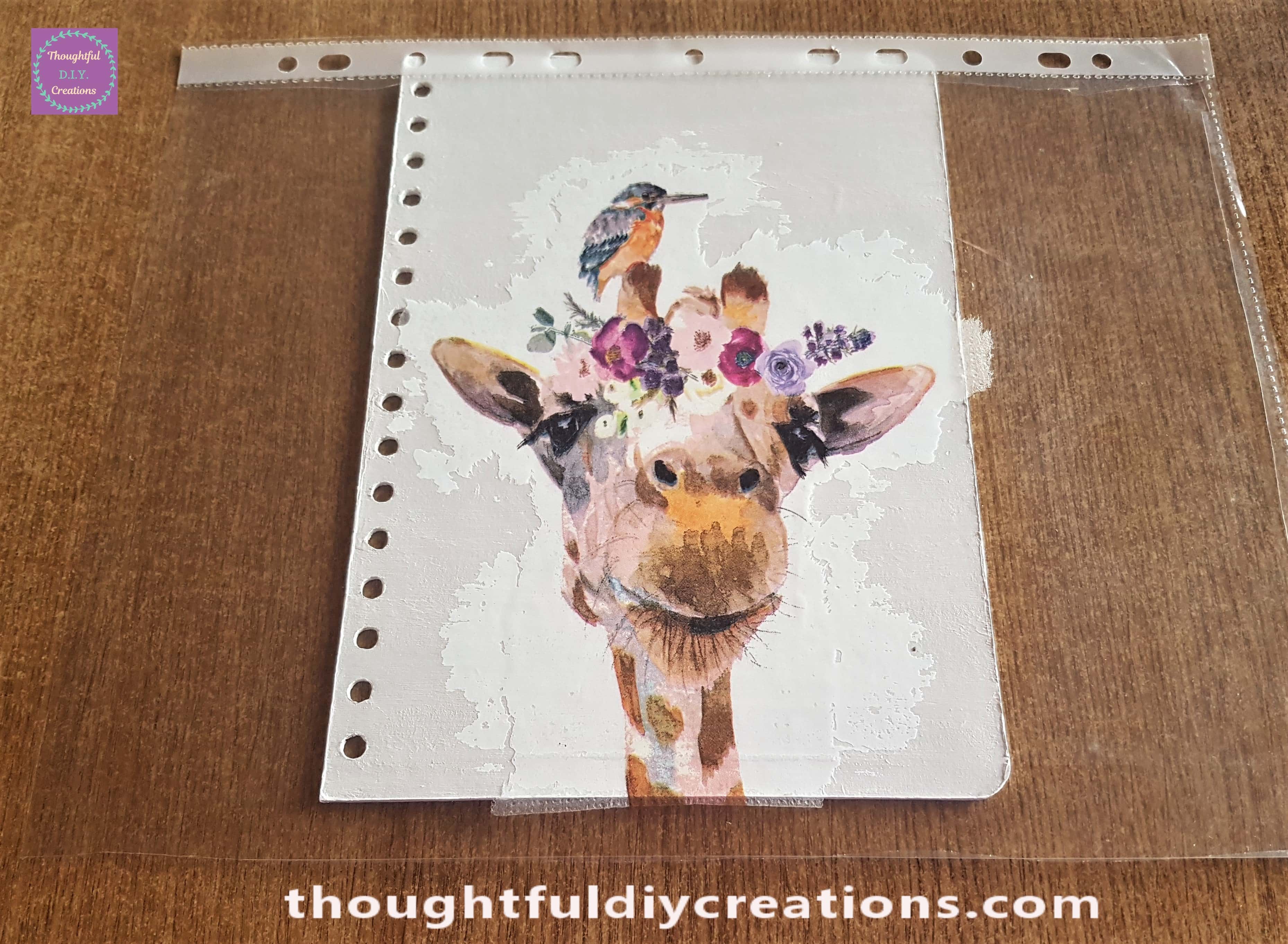 Front Journal Cover in front of me on the Table. The Plastic Sheet with Napkin attached turned over and positioned on the Journal Cover.