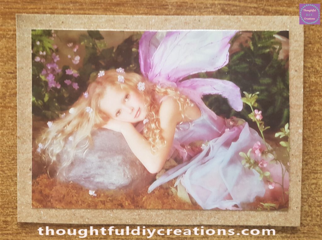 Attached the Fairy Image to the Brown Card using Pritt Stick.
