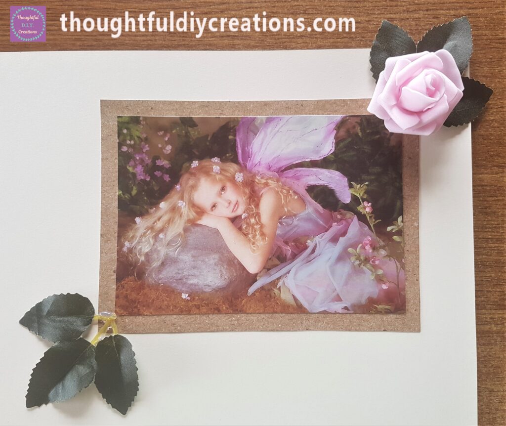 Hot Glued the other set of leaves to the bottom left hand side of the Fairy Image.