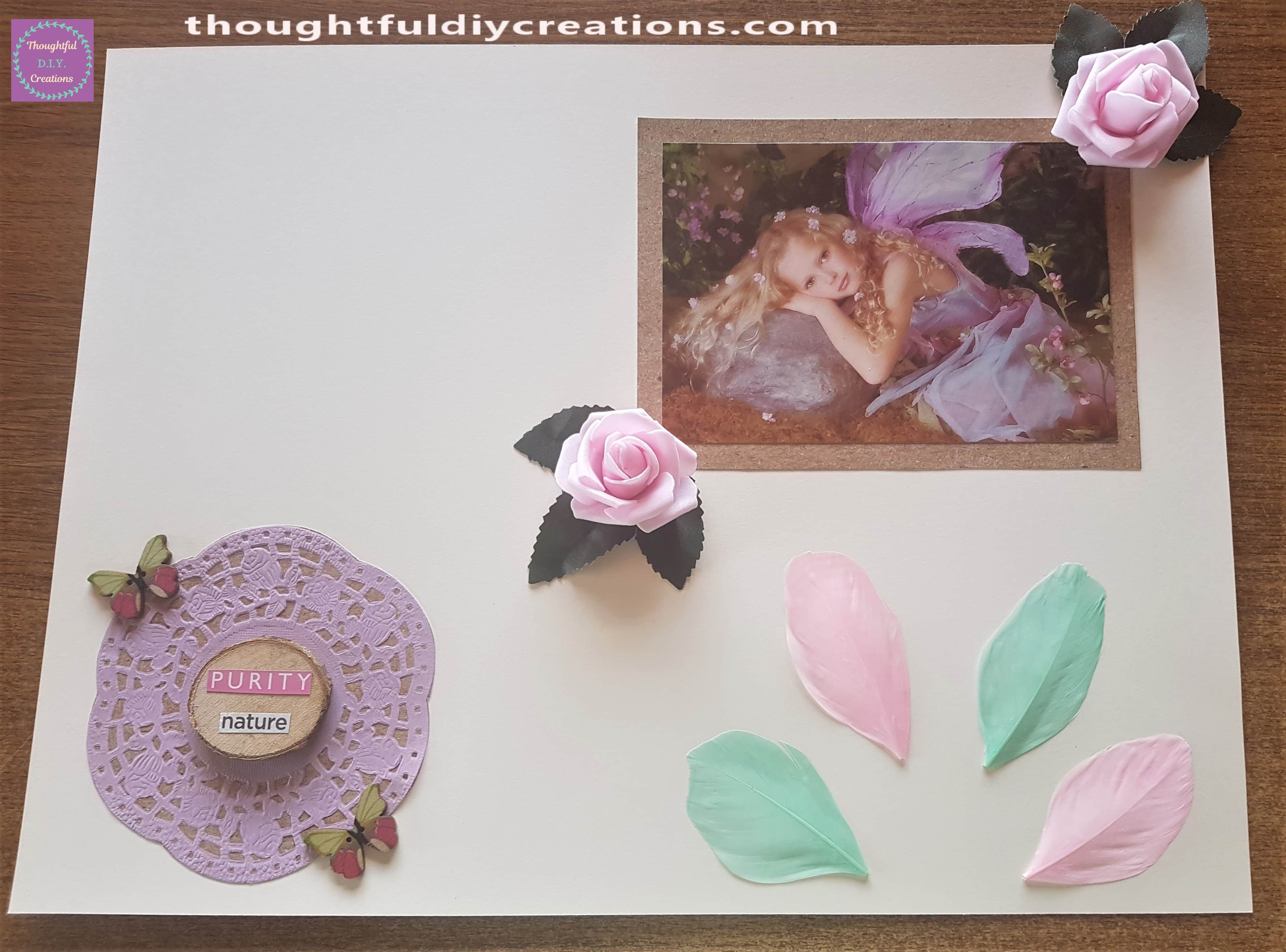 2 pink and 2 green feathers attached to the bottom right hand side of the Scrapbook layout.