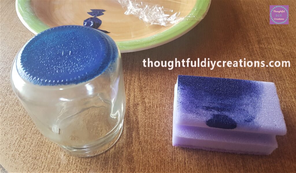 Blue Paint on a Plate, sponge dabbed on the paint and dabbed all over the bottom of the jar.