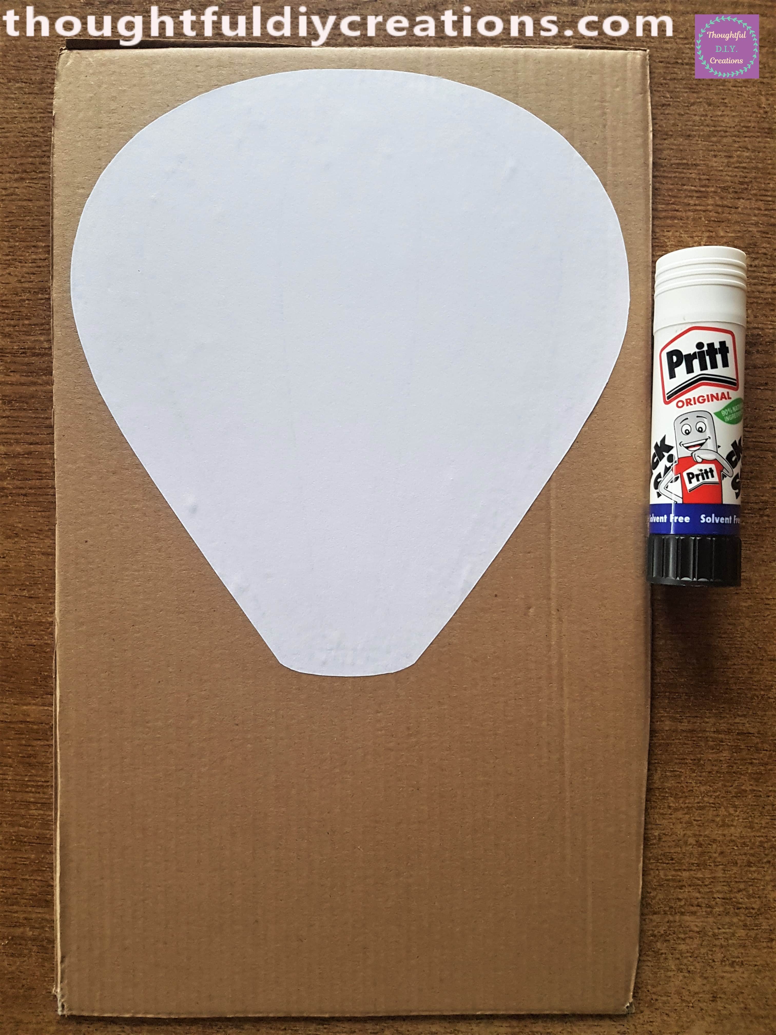I attached the Hot Air Balloon Template to the Cardboard using Pritt Stick.