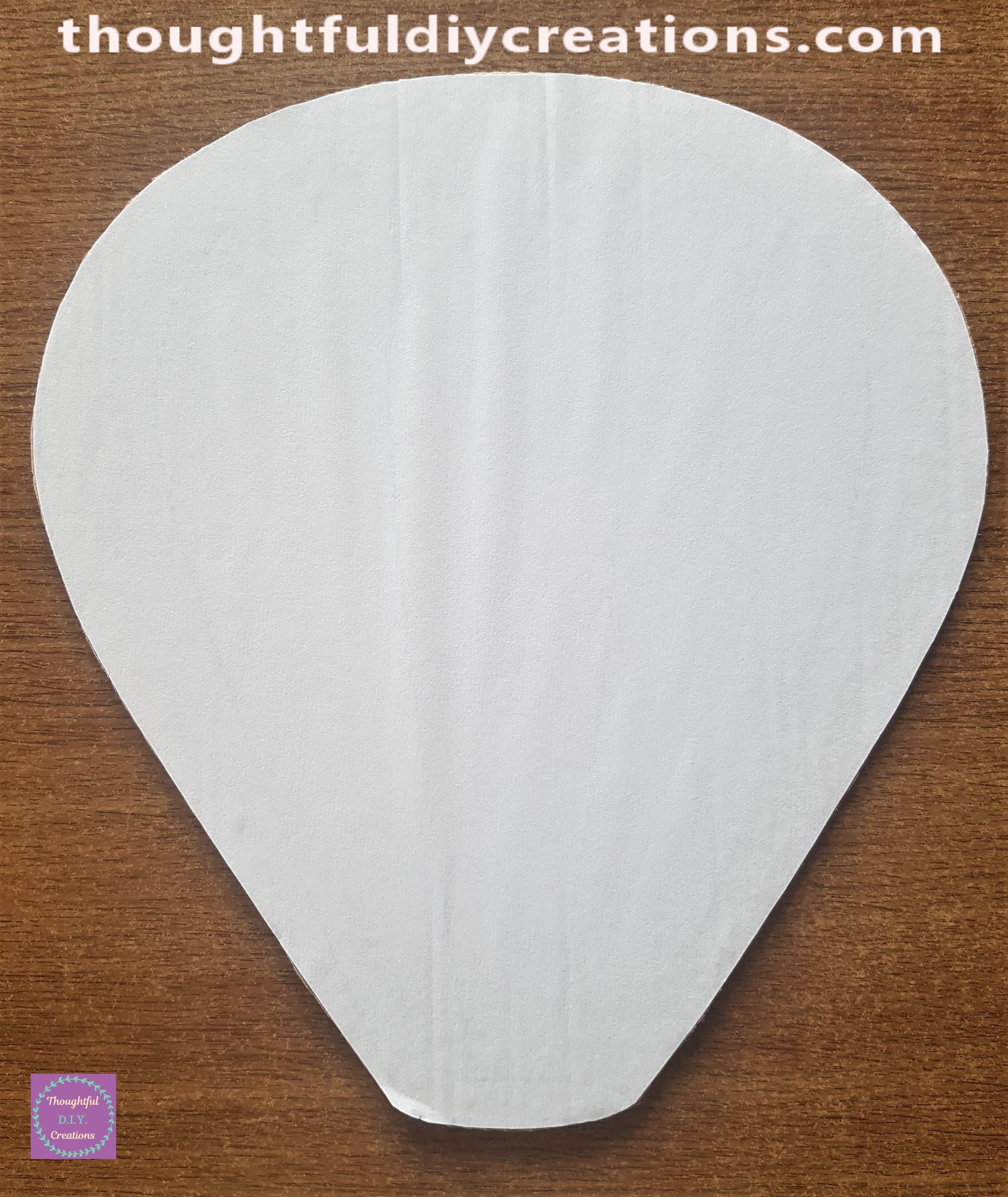 I cut around the Hot Air Balloon on the Cardboard. It is the base for the Hot Air Balloon Craft.