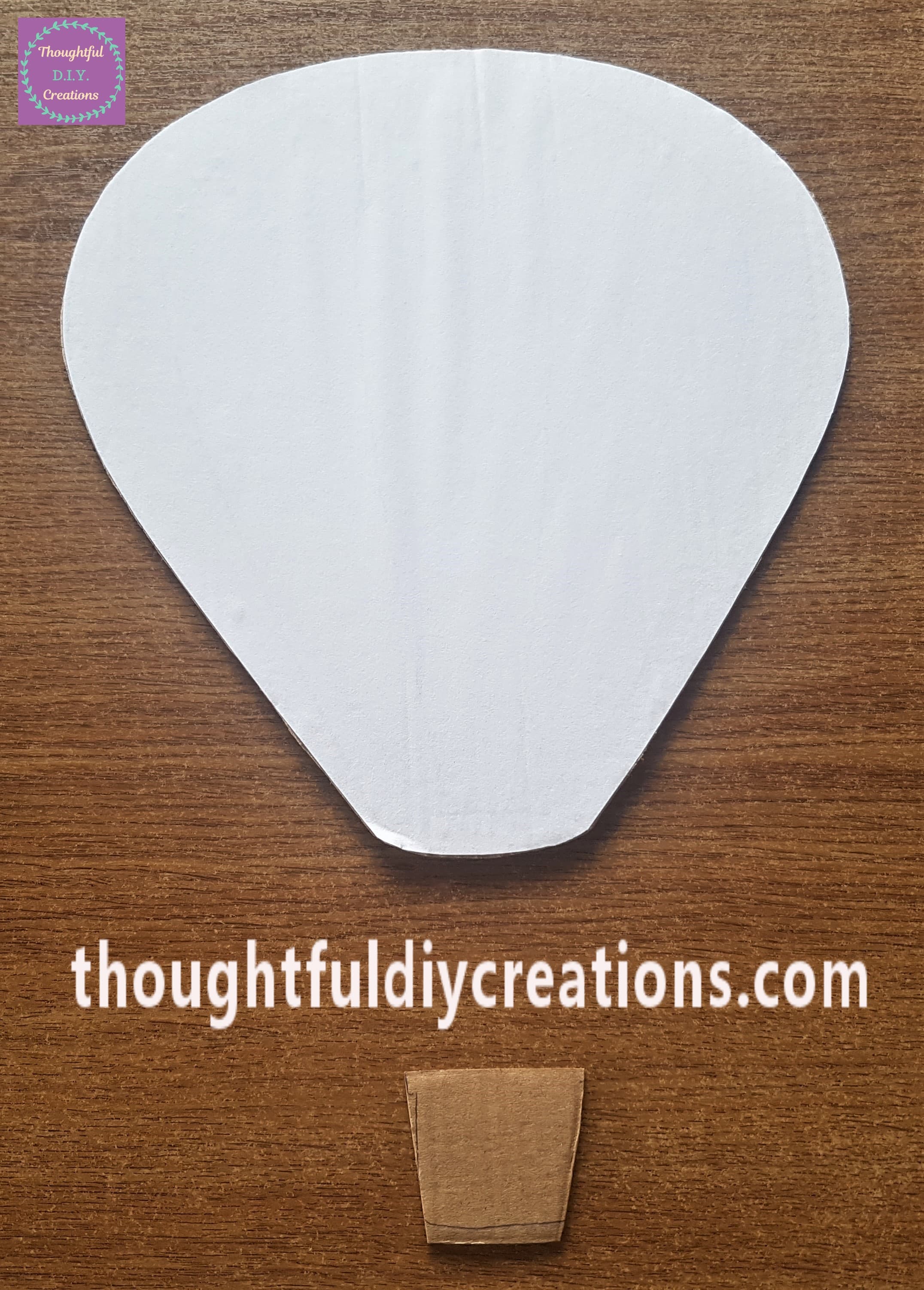 I cut out a basket from the leftover cardboard from the Hot Air Balloon.