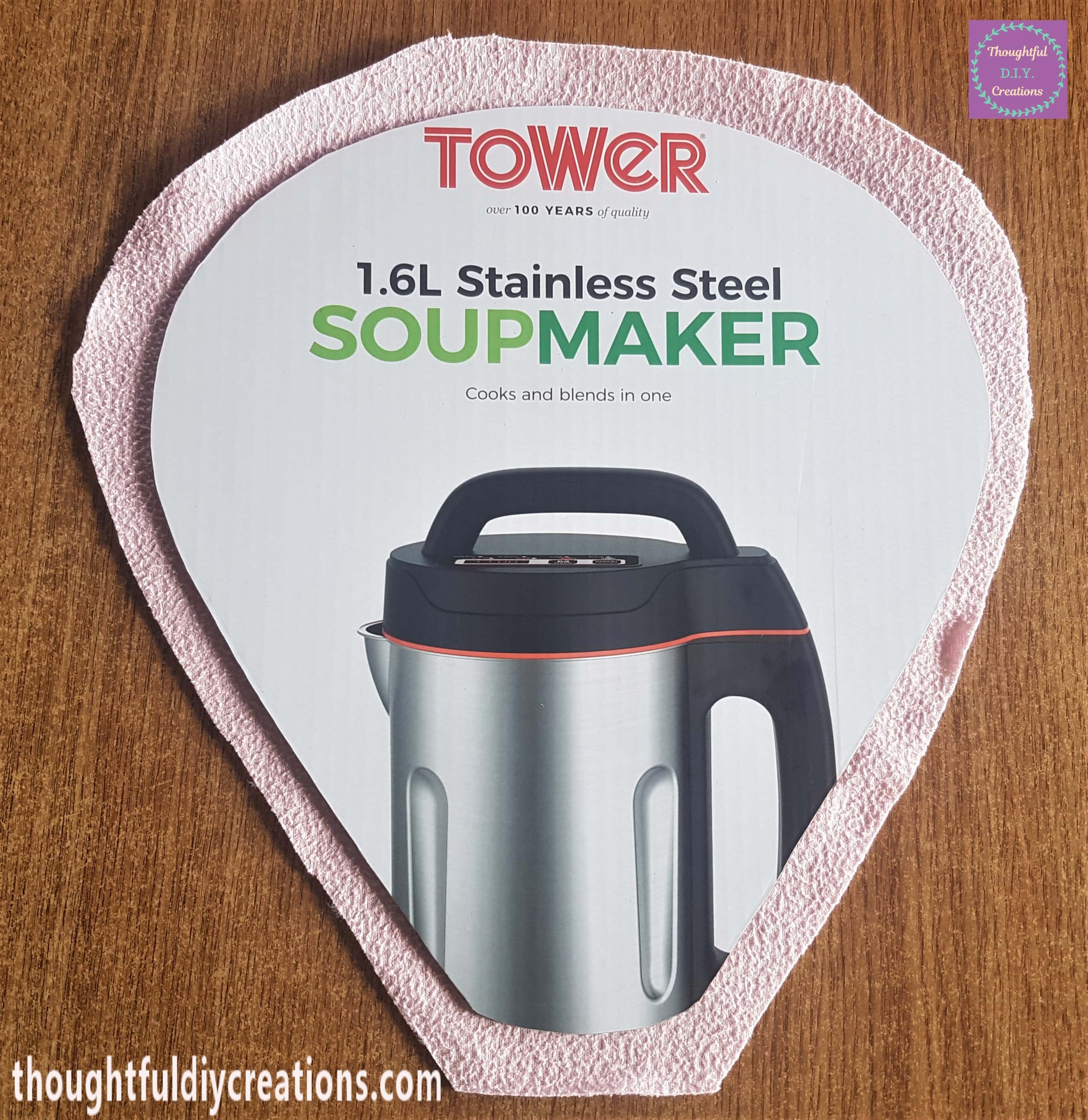 Fleece face down on table, hot air balloon face down on top of the fleece.