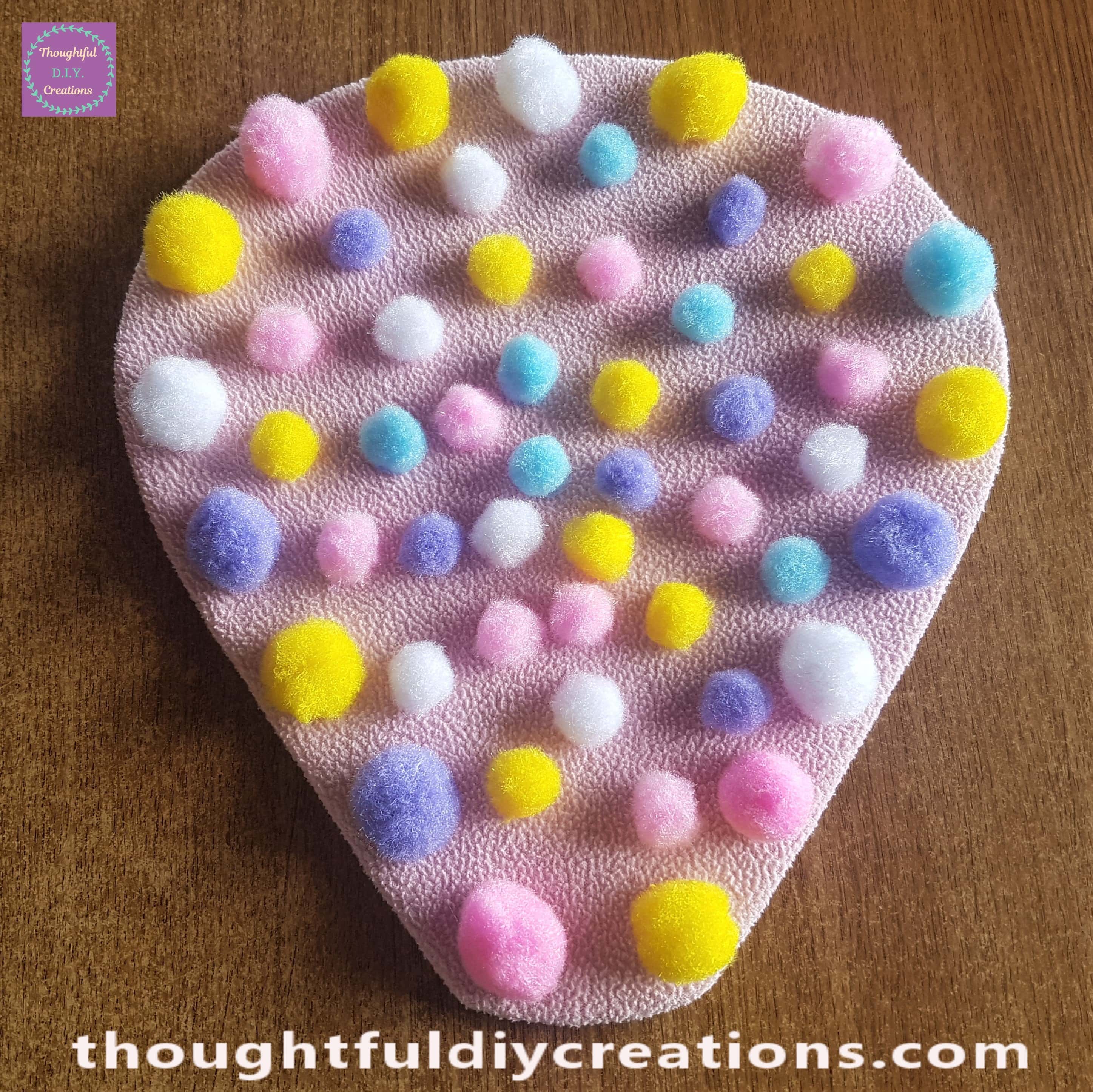 Pom poms added to the center of the Hot Air Balloon.