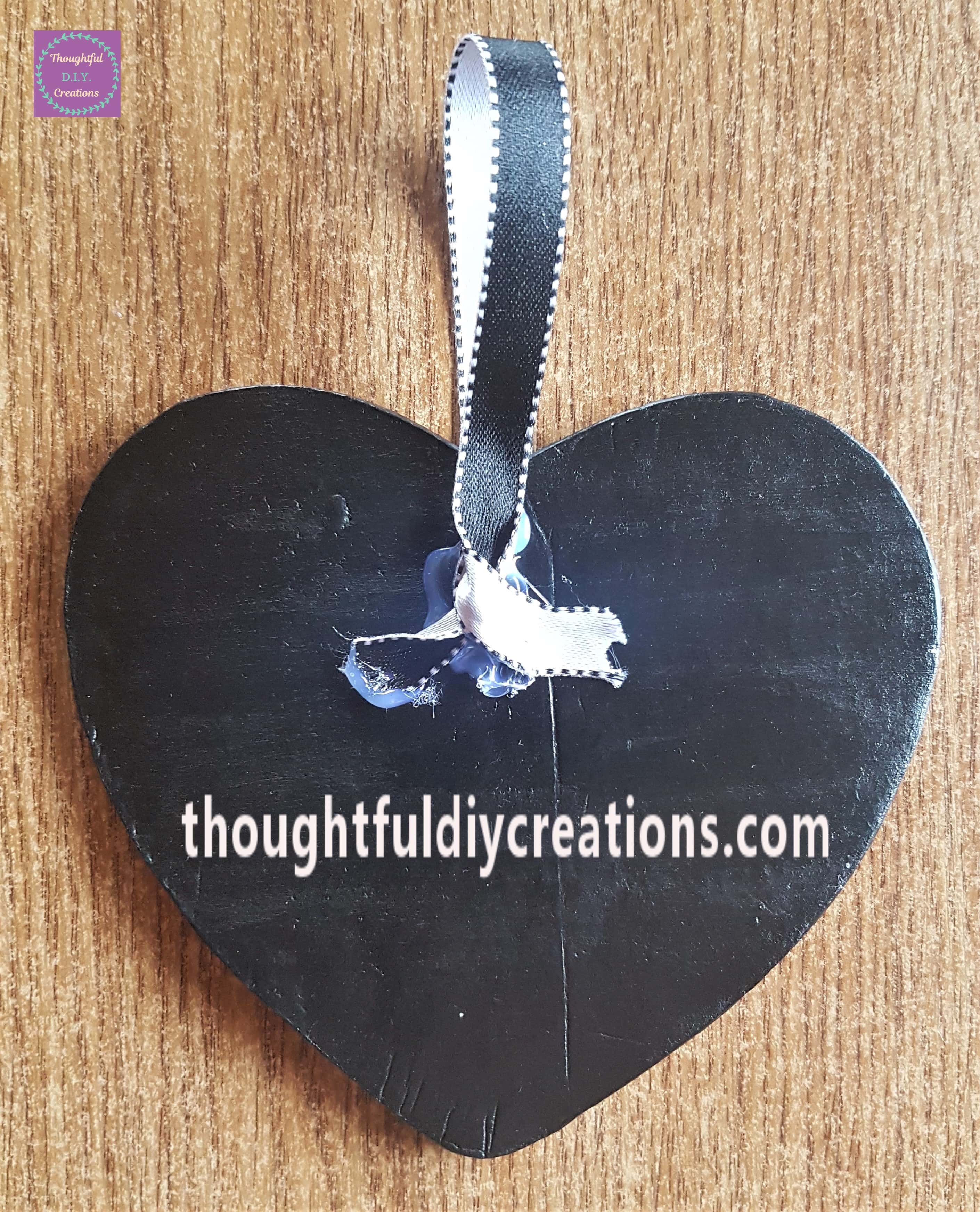 Clear Glue from my Hot Glue Gun to the 2 ends of Ribbon at the back of the Heart.