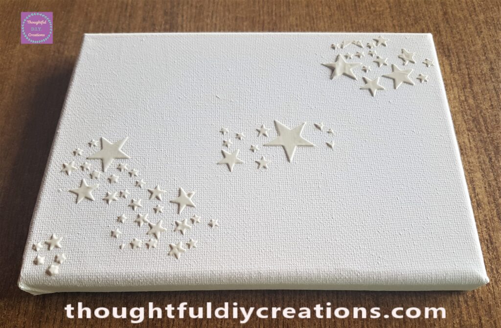 Side angle of the Canvas with the Stars added with Modelling Paste.