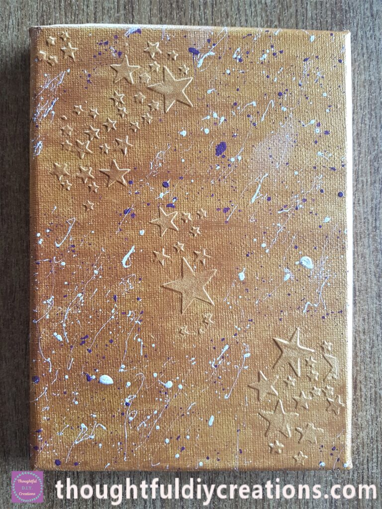 The canvas a couple of hours later when the splatters were completely dry.