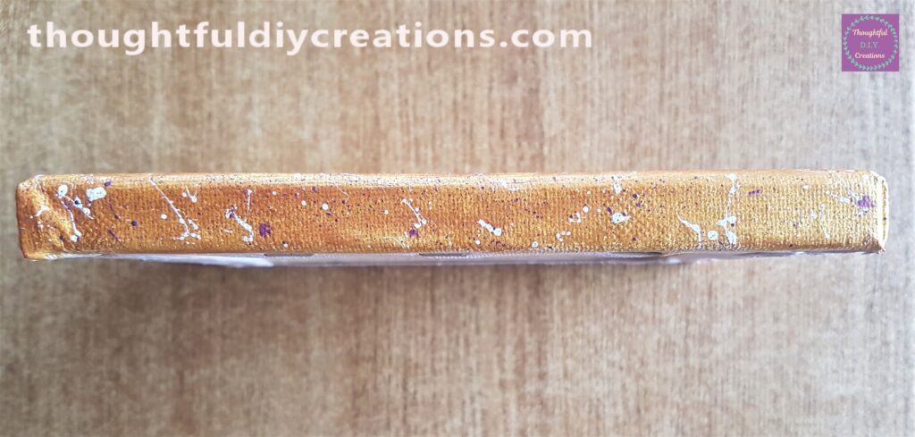 Purple splatters were added to the sides when the white splatters were fully dry.