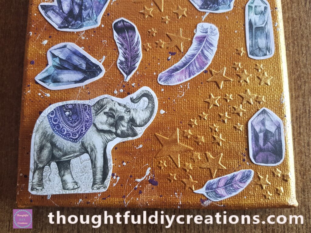 PVA glue on the back of the Cardboard and attached the Elephant to the bottom left hand side of the Canvas.