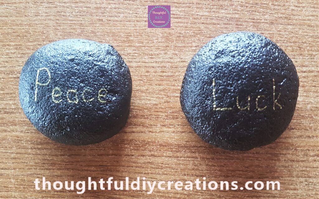 I wrote Peace and Luck onto the Painted Black Stones with the Gold Paint Pen.