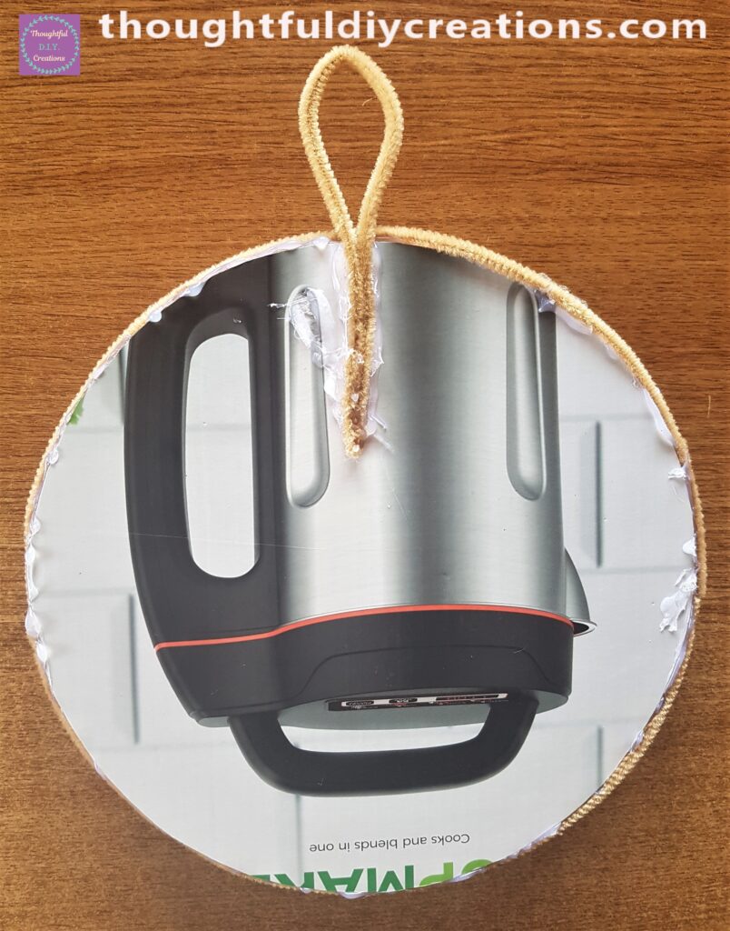 I attached it to the back of the Autumn Wreath with Hot Glue.