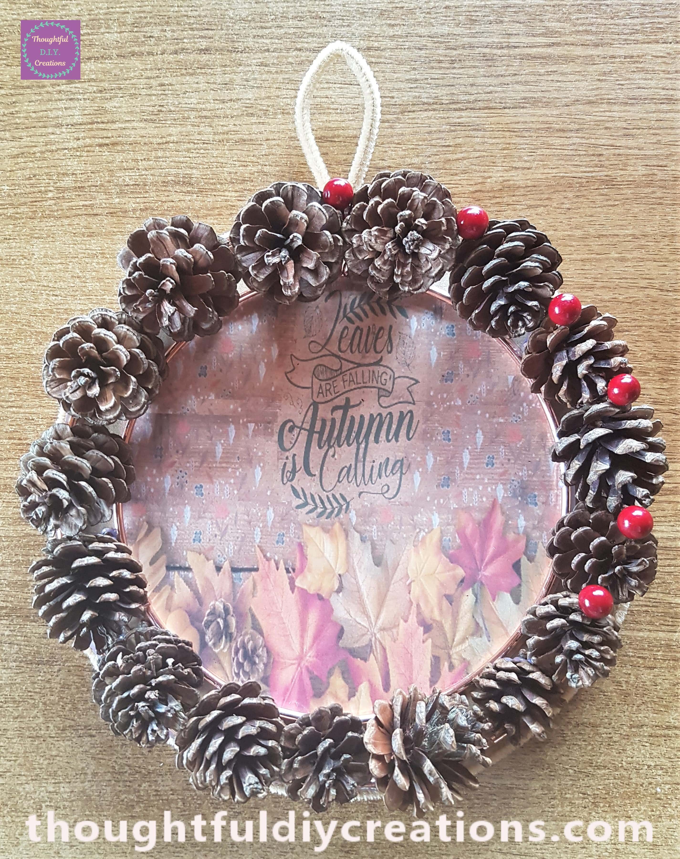 I placed the berry in between the first two pine cones. The wire from the stem just slotted into the pine cone shell.