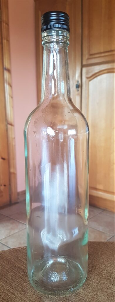 Wine Bottle after being soaked in the sink, label removed, rinsed and dried.