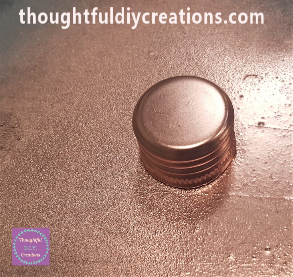 I spray painted the top and sides of the wine bottle lid.