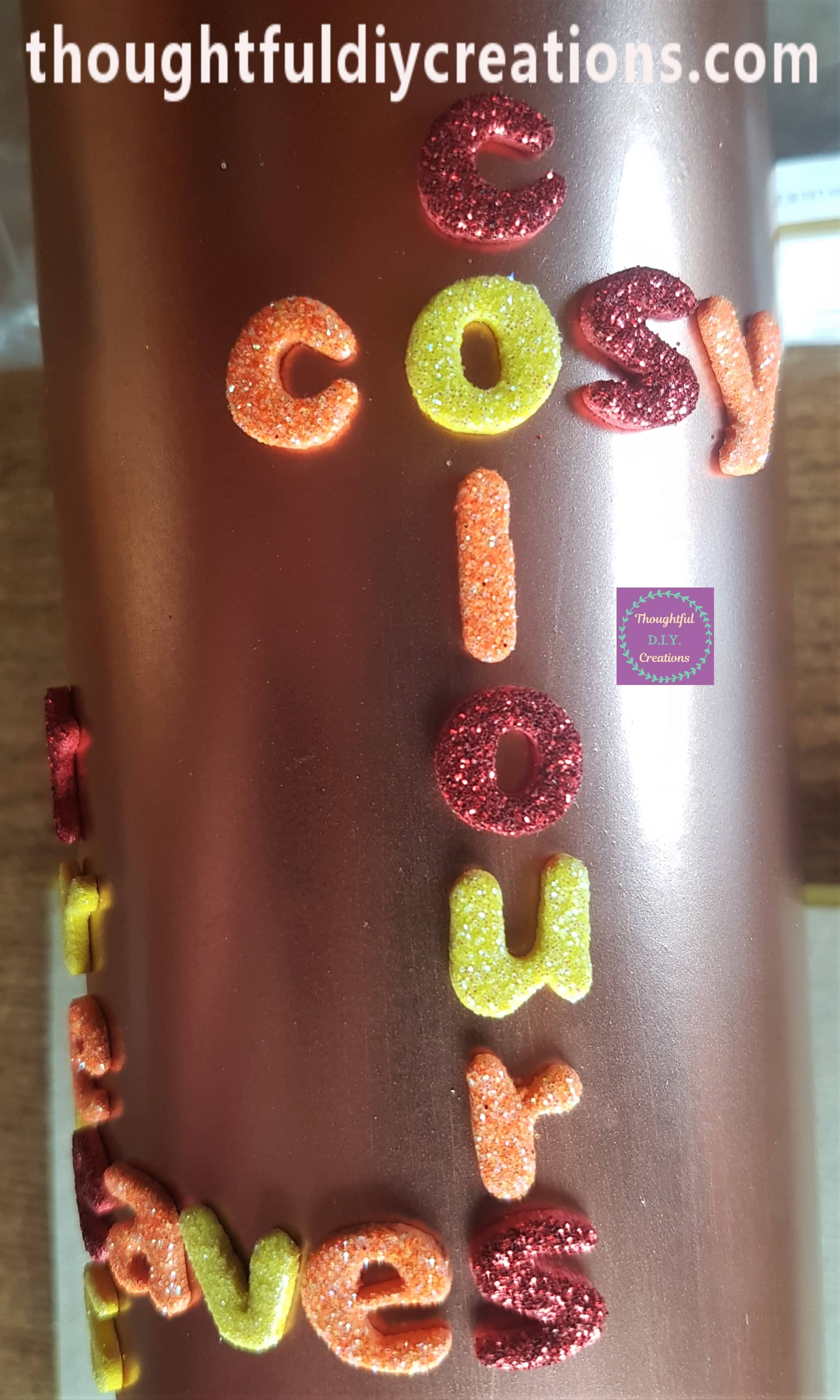 I added the word 'cosy' across the letter 'o' from the word 'colours' on the Bottle.