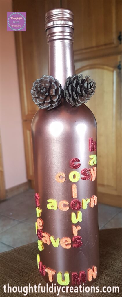 I attached them to the neck of the Bottle using my Hot Glue Gun.