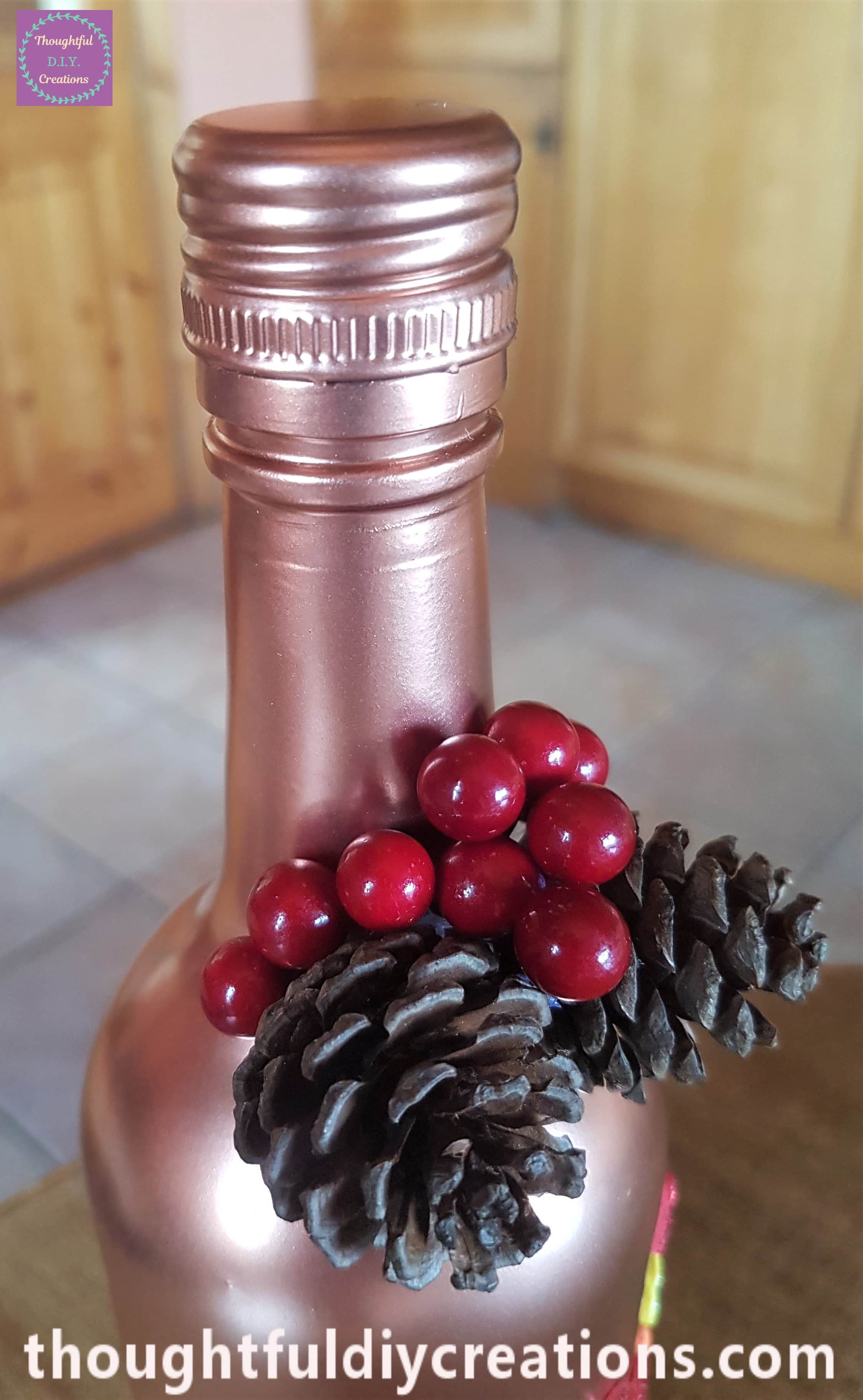 I glued 3 red berries to the side of the first pine cone.