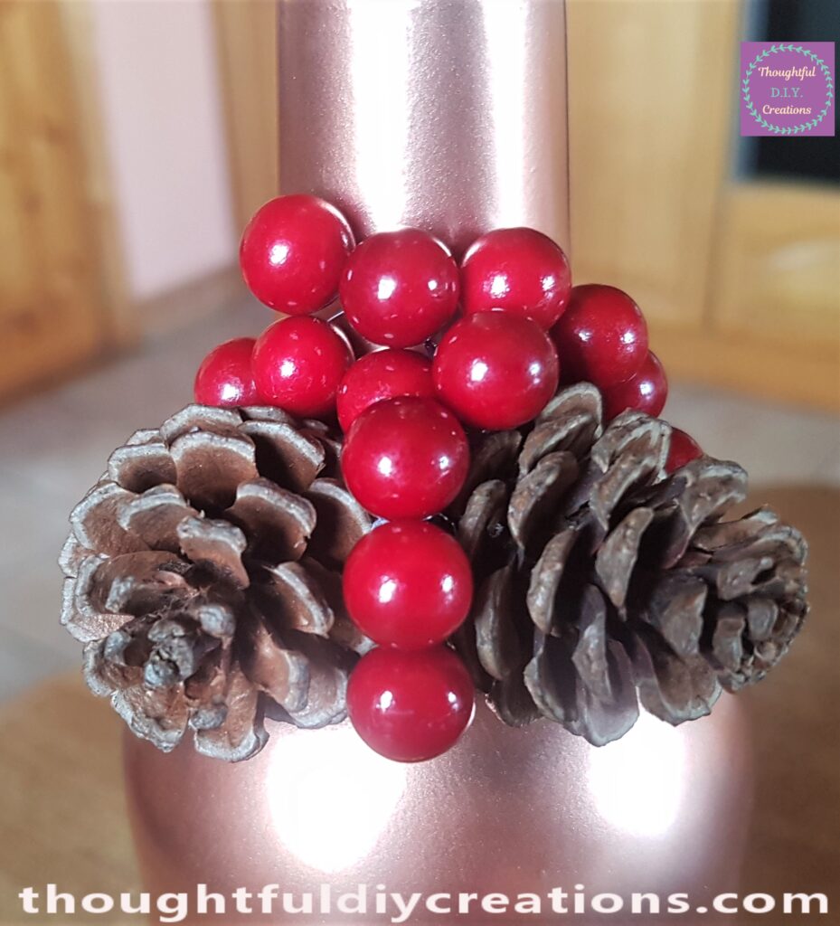 I added more berries to the mid-section of the pine cones.