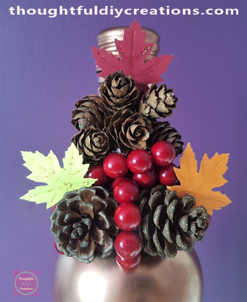 I pushed the stem of each leaf down the back of the pine cones.