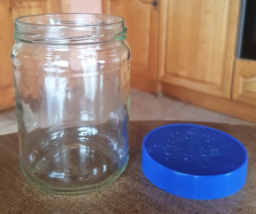 Jar and Lid after being soaked in the sink, labels scrubbed off, rinsed and dried.