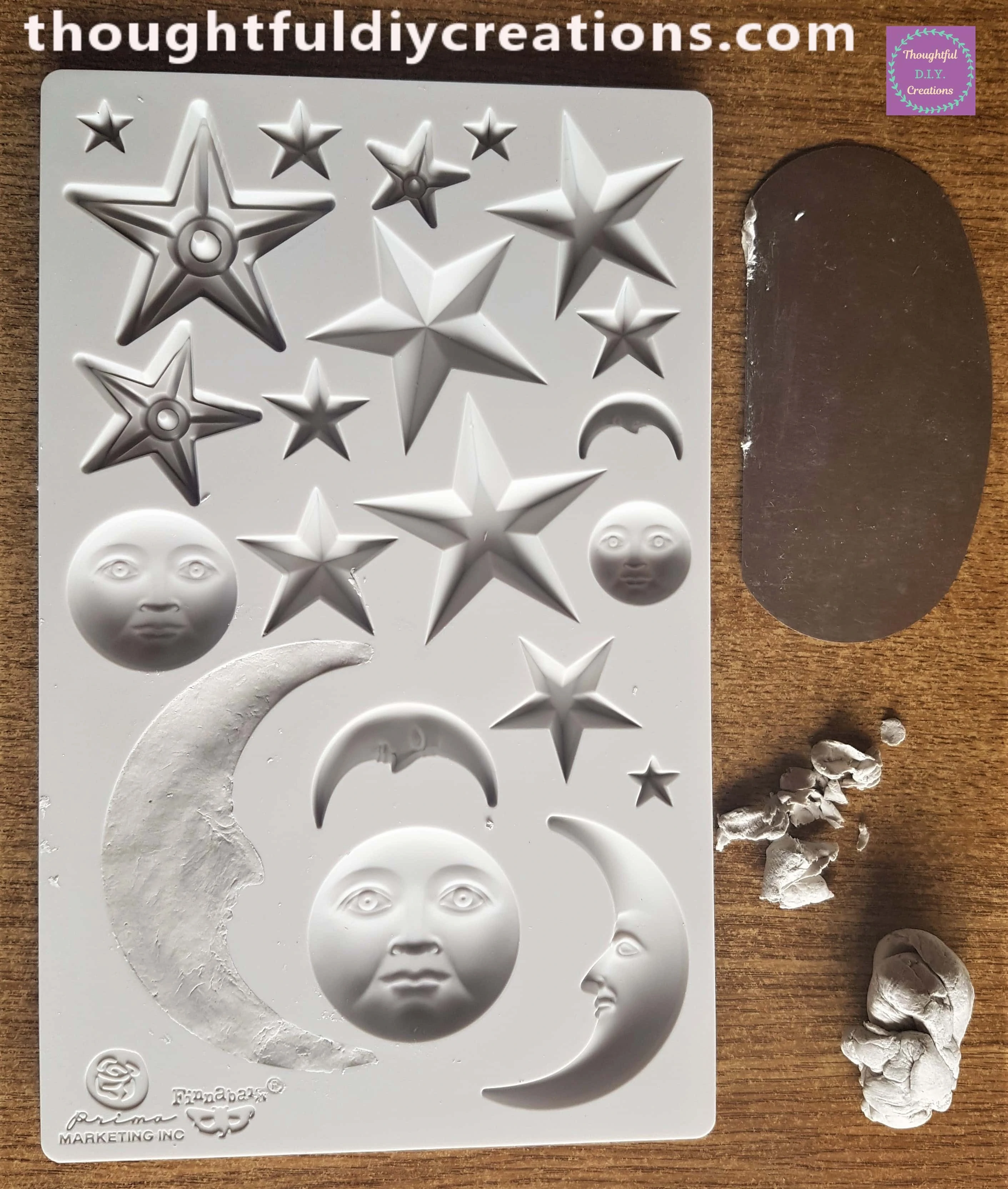 I removed the excess clay around the moon with a Steel Kidney Scraper.