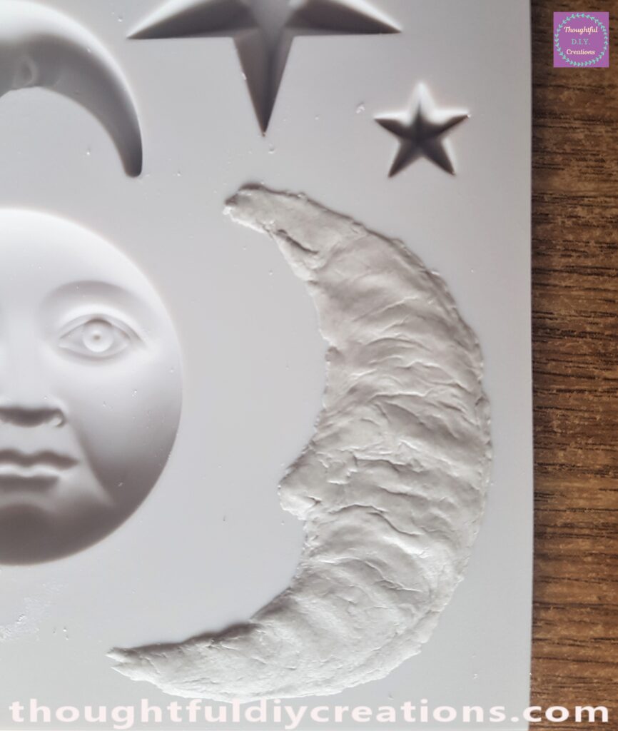 I pressed the Clay into the Moon Mould.
