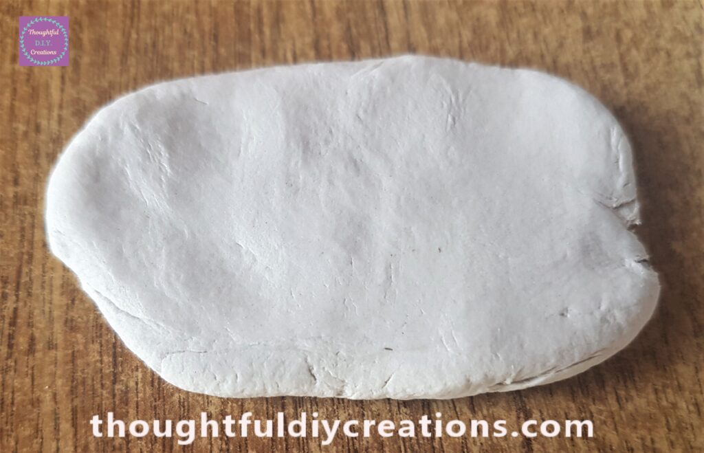 I smoothed and flattened the clay out using my hands.