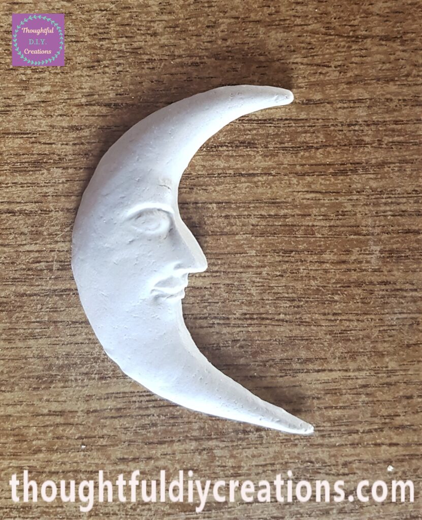 I dipped the paintbrush into the water and smoothed out any lines in the Clay Moon.