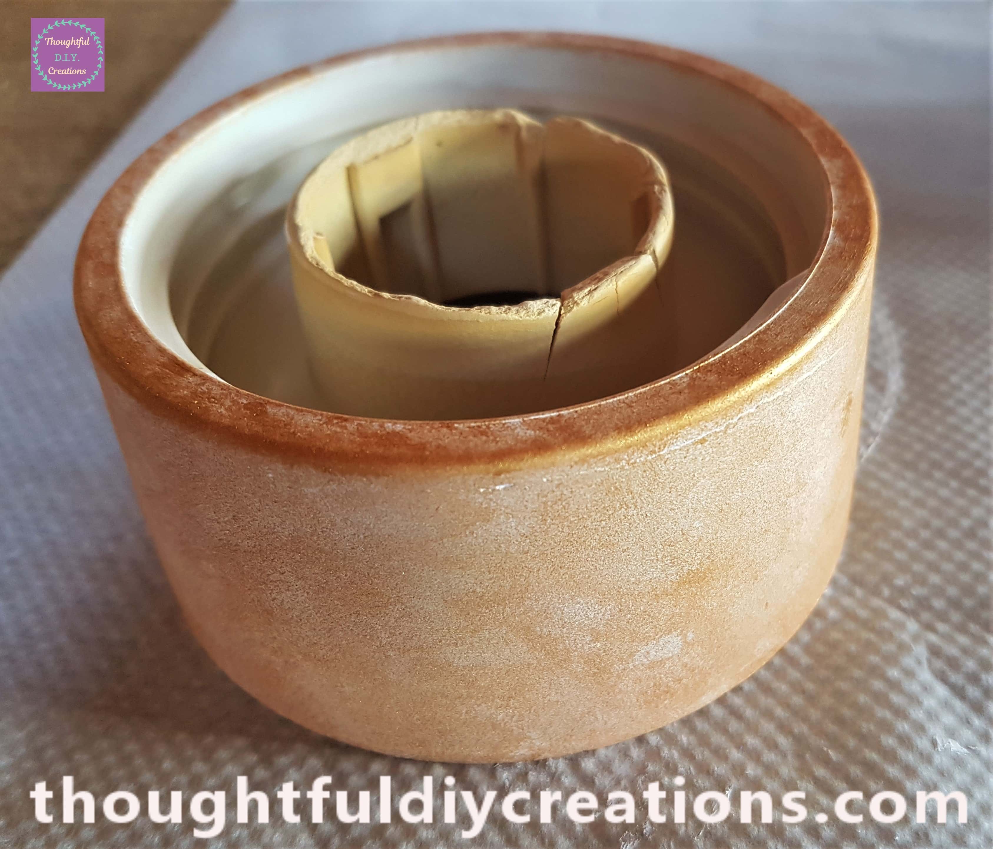 I used the softer part of the sponge and Dabbed the Gold Paint onto the outside and top of the Stand until it had one layer of paint.