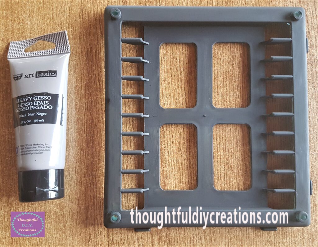 I applied 1 coat of black heavy gesso to the frame using a medium flat paintbrush to prime it.