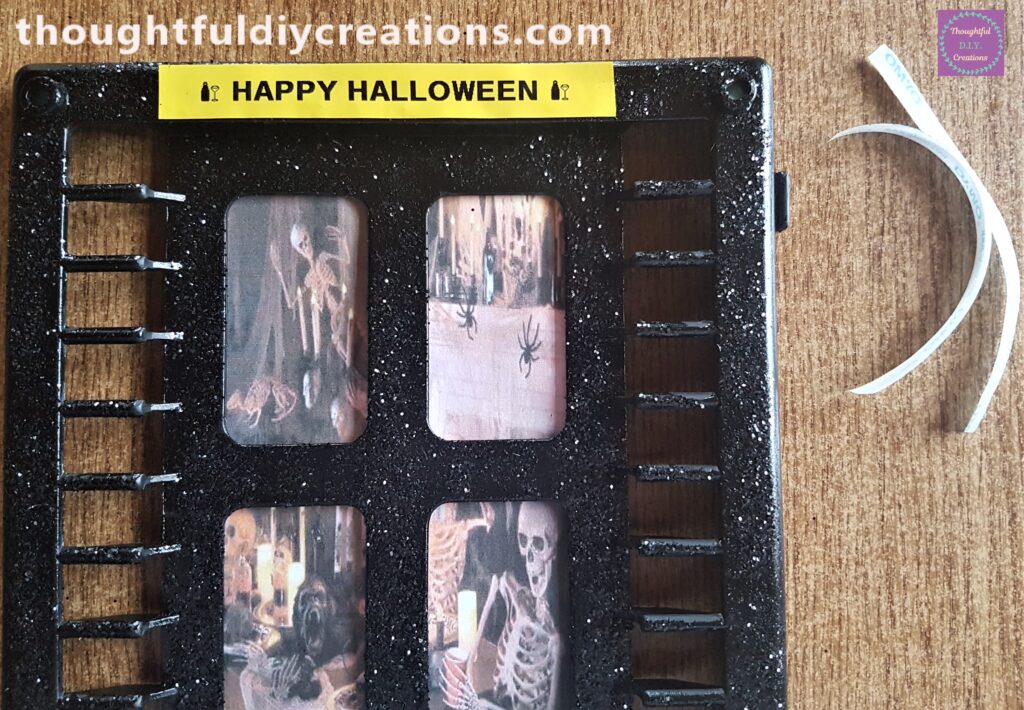 DYMO LetraTag Label Maker used to print HAPPY HALLOWEEN Sticker and attached to the top of the Halloween Window.