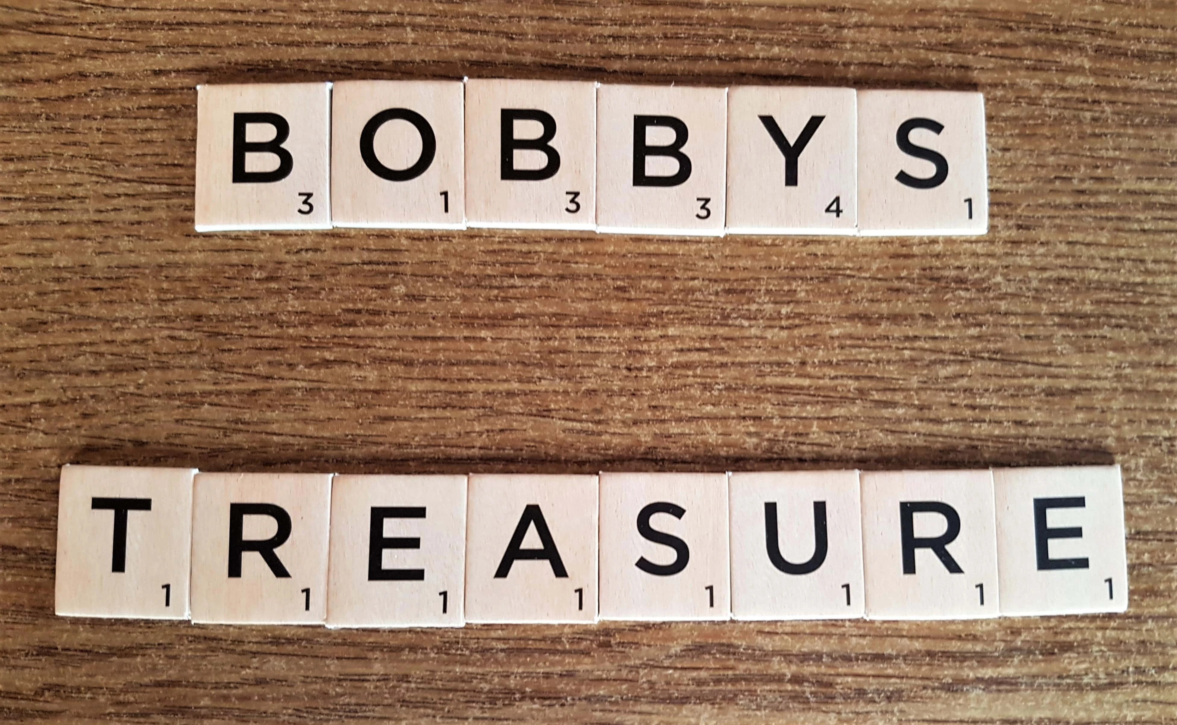 I got my Pack of Scrabble Tile Letters and spelled out the words Bobby's Treasure.