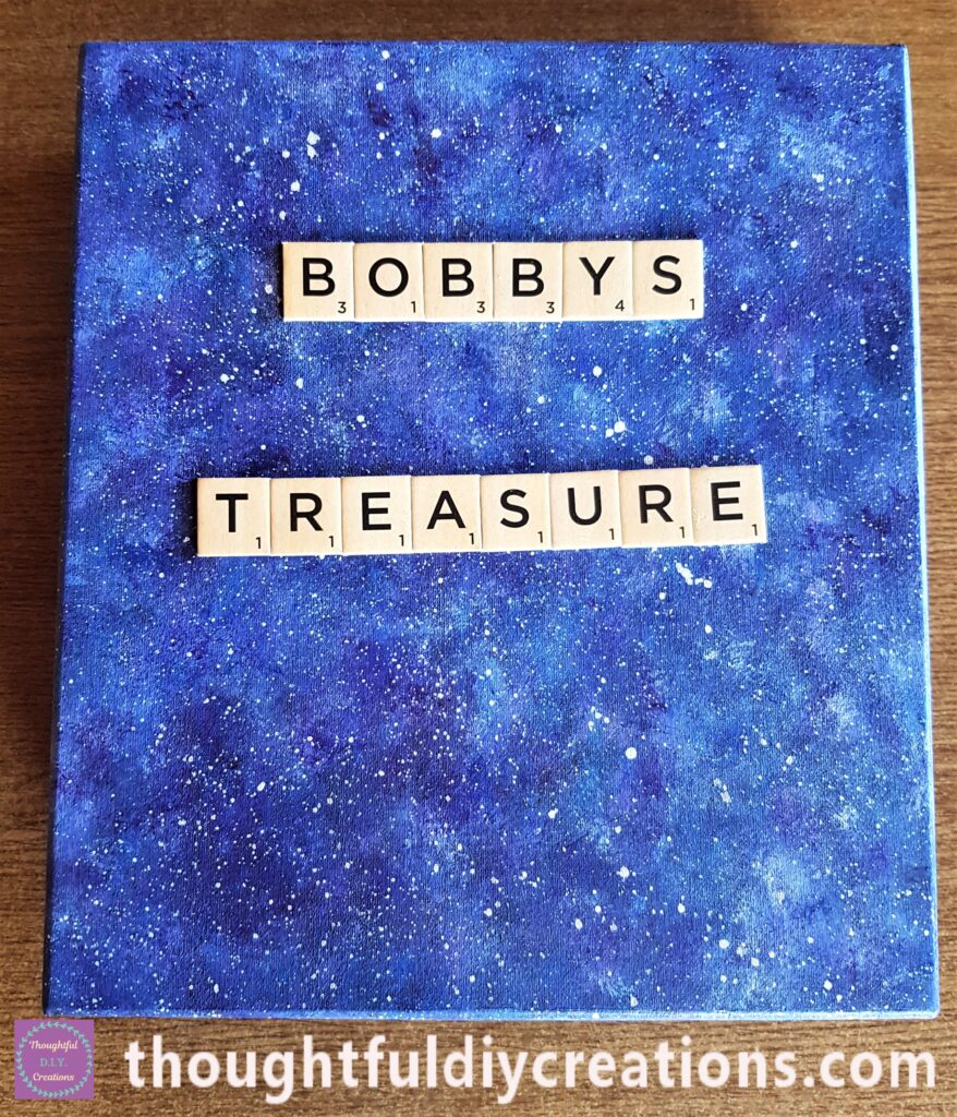 I attached each tile letter to the galaxy lid with glue and a paintbrush.