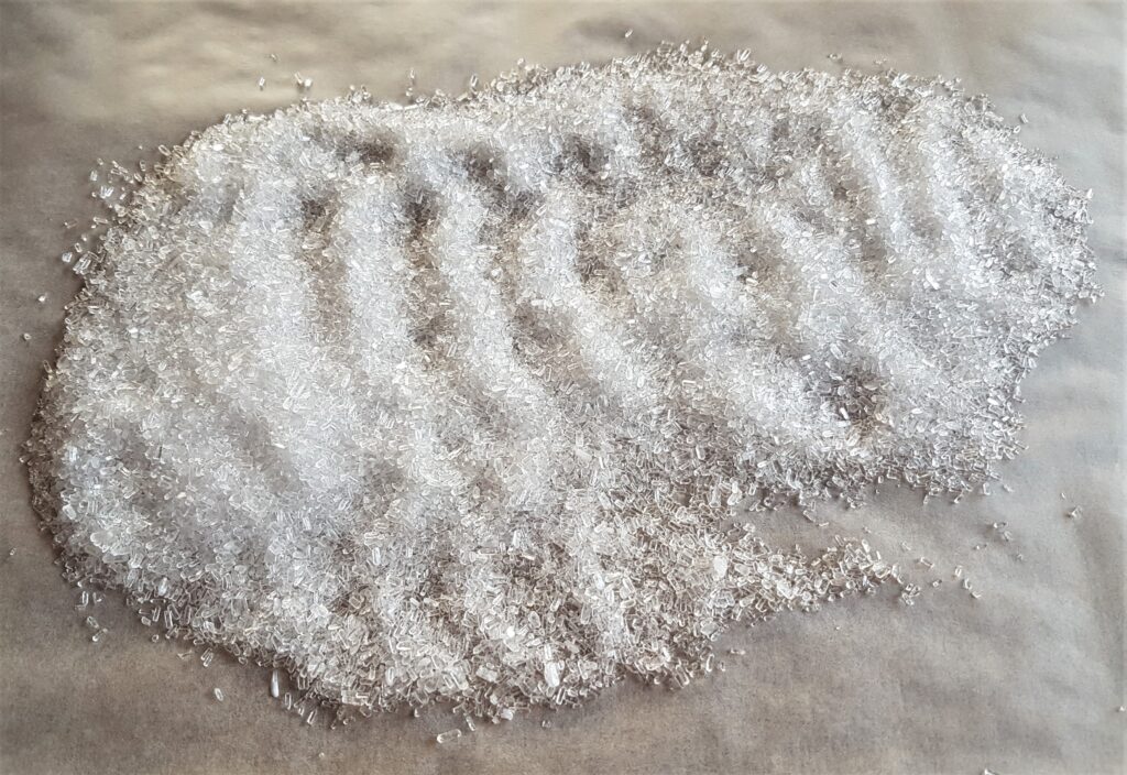 I poured some Epsom Salts into the center of the Baking Paper on the Table.