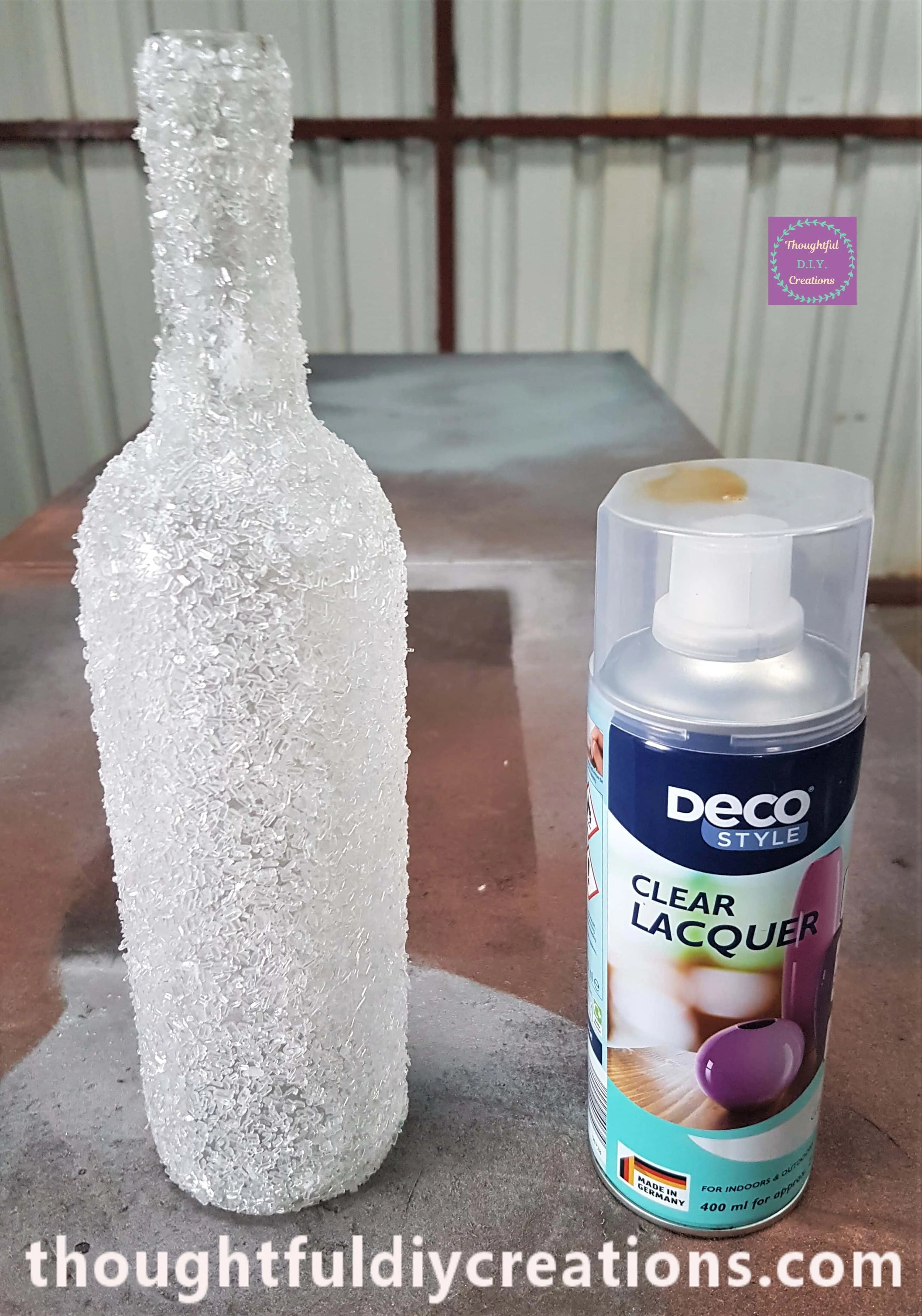 Frosted Glass Bottle in the shed on a table. I got my Clear Lacquer Gloss Top Coat spray paint.