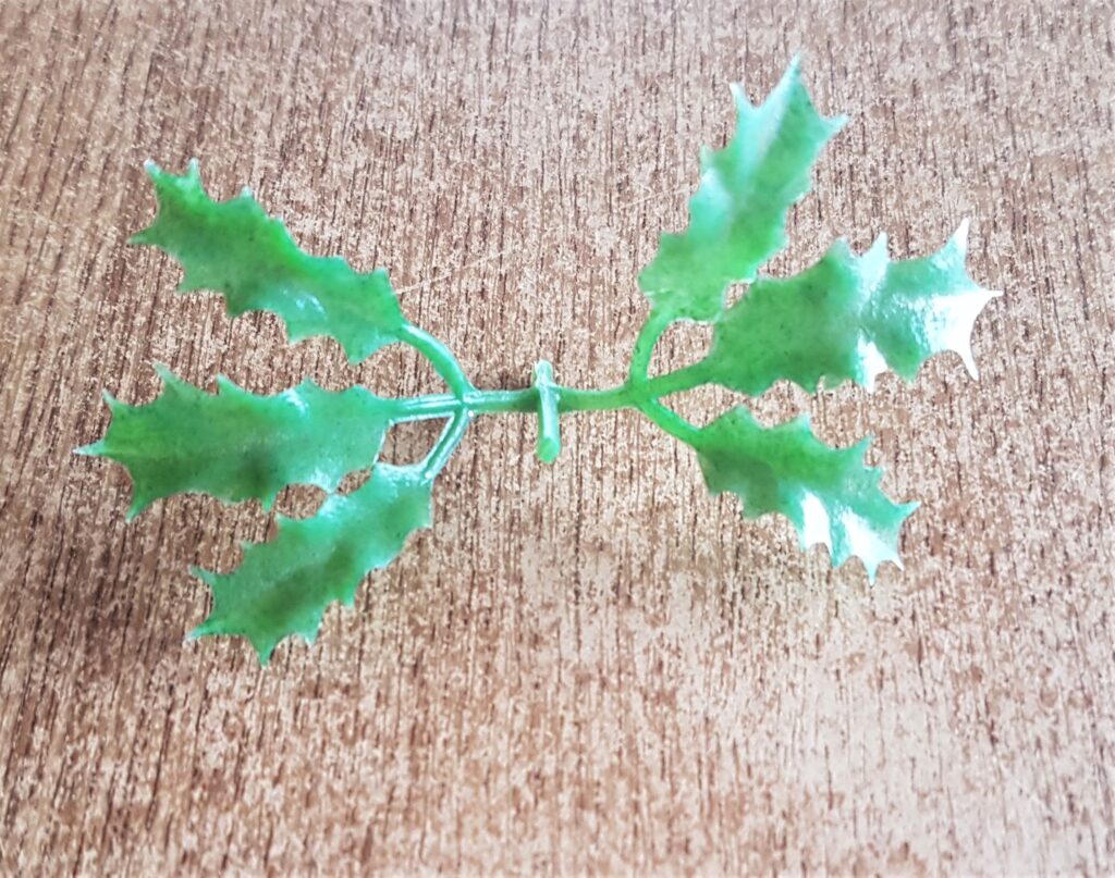 The part of the holly leaves that I cut off before I attached it to the bottle.