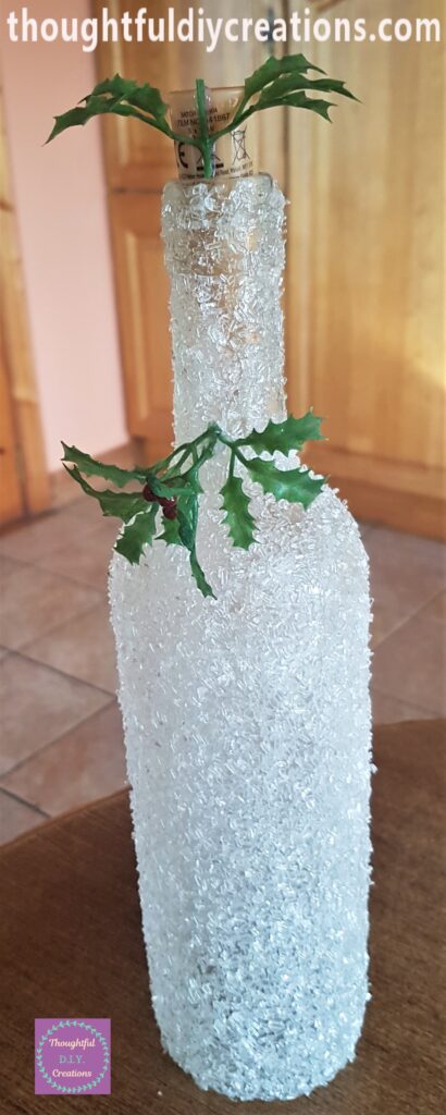 Hot Glue on the middle stem and attached to the top of the lights.